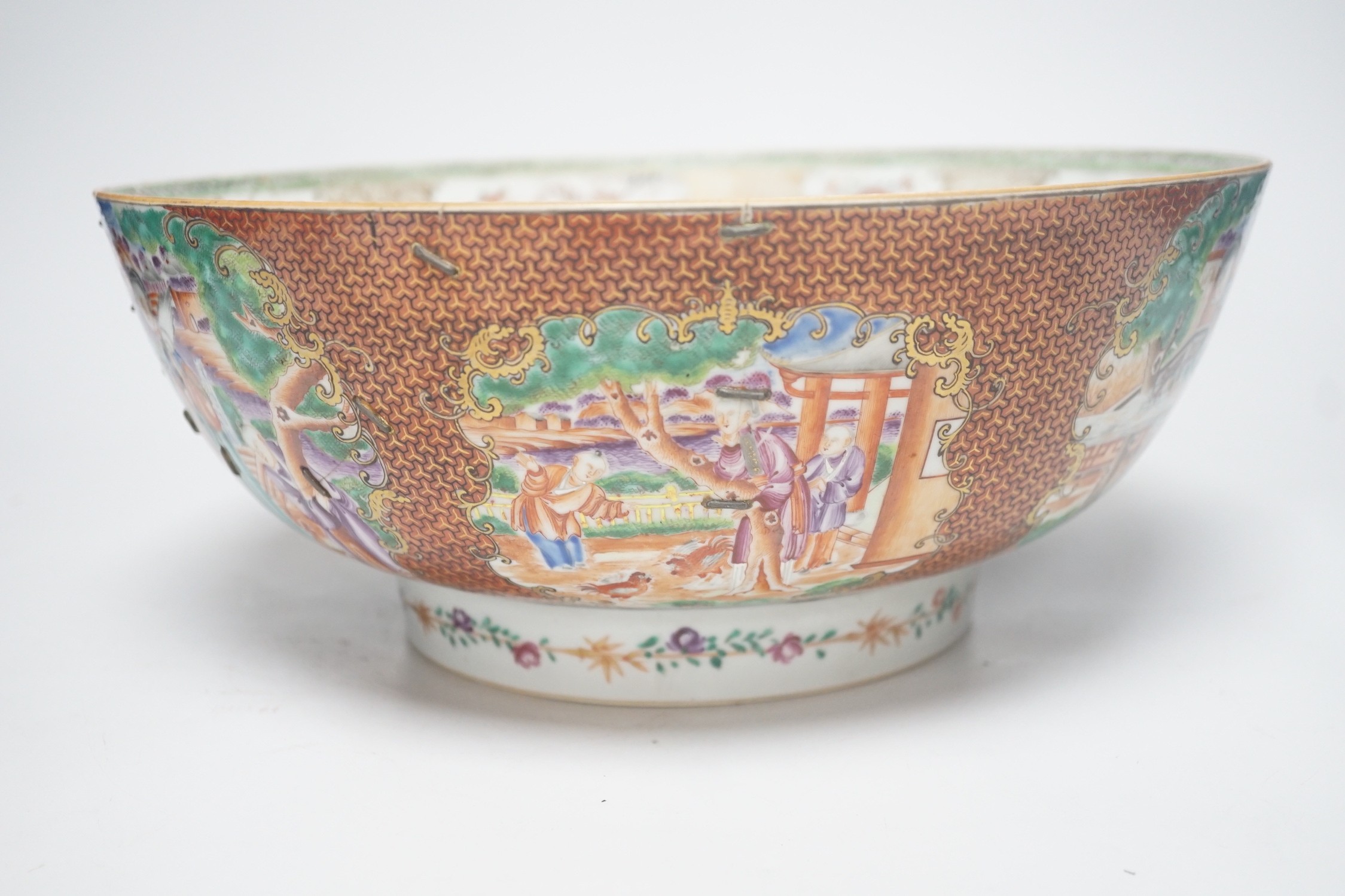 An 18th century Chinese export famille rose ‘mandarin’ punch bowl, 31cm diameter (af)